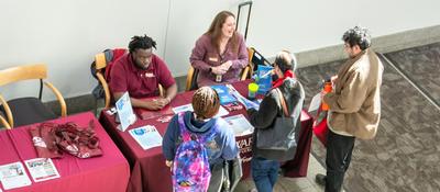 students registering at a table