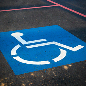 photo of wheelchair symbol on the ground: Accessibility Services