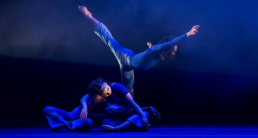 two dancers under blue light