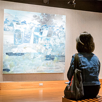 Woman sitting the art gallery