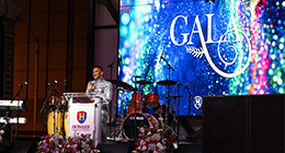 Dr. Daria J. Willis presenting on stage at the President's Gala event.