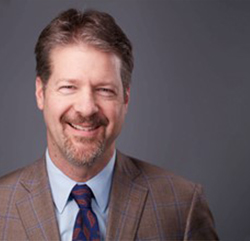 Headshot of Greg Ftichitt