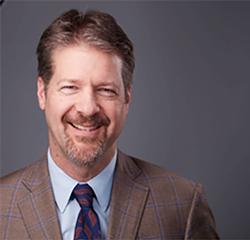 Headshot of Greg Ftichitt