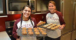 Two Rouse Scholars baking