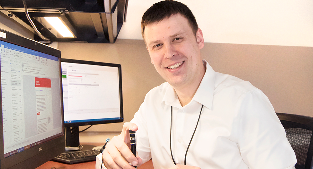 Smiling student at a computer