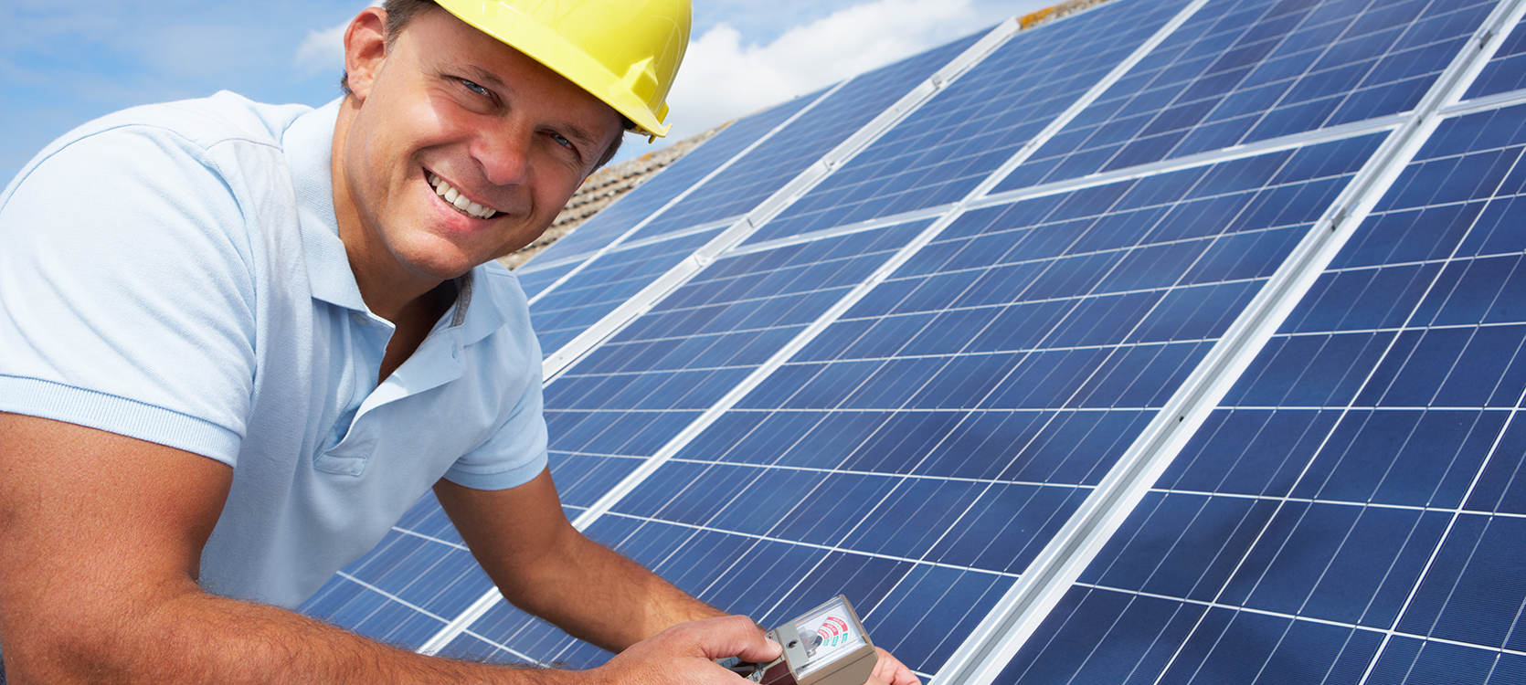 A solar panel technician on the job