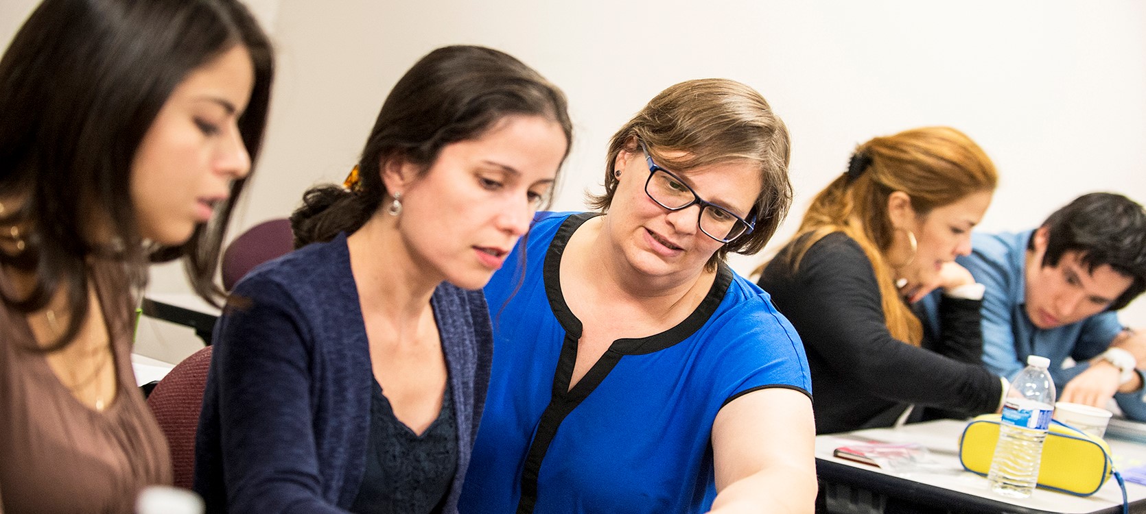 elc students studying with teachers