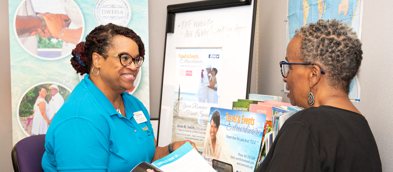 Two people having a conversation over reading materials