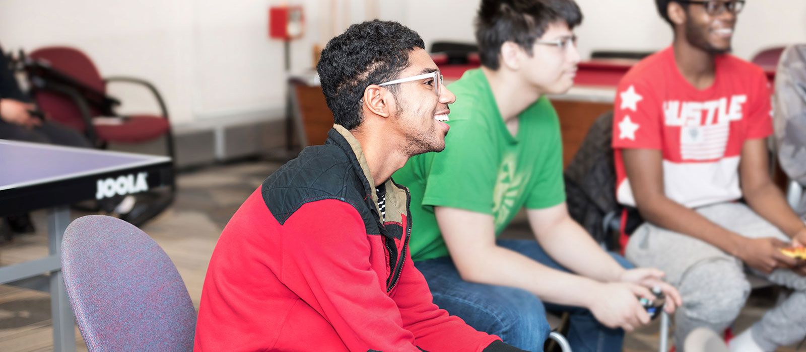 Three students playing a video game