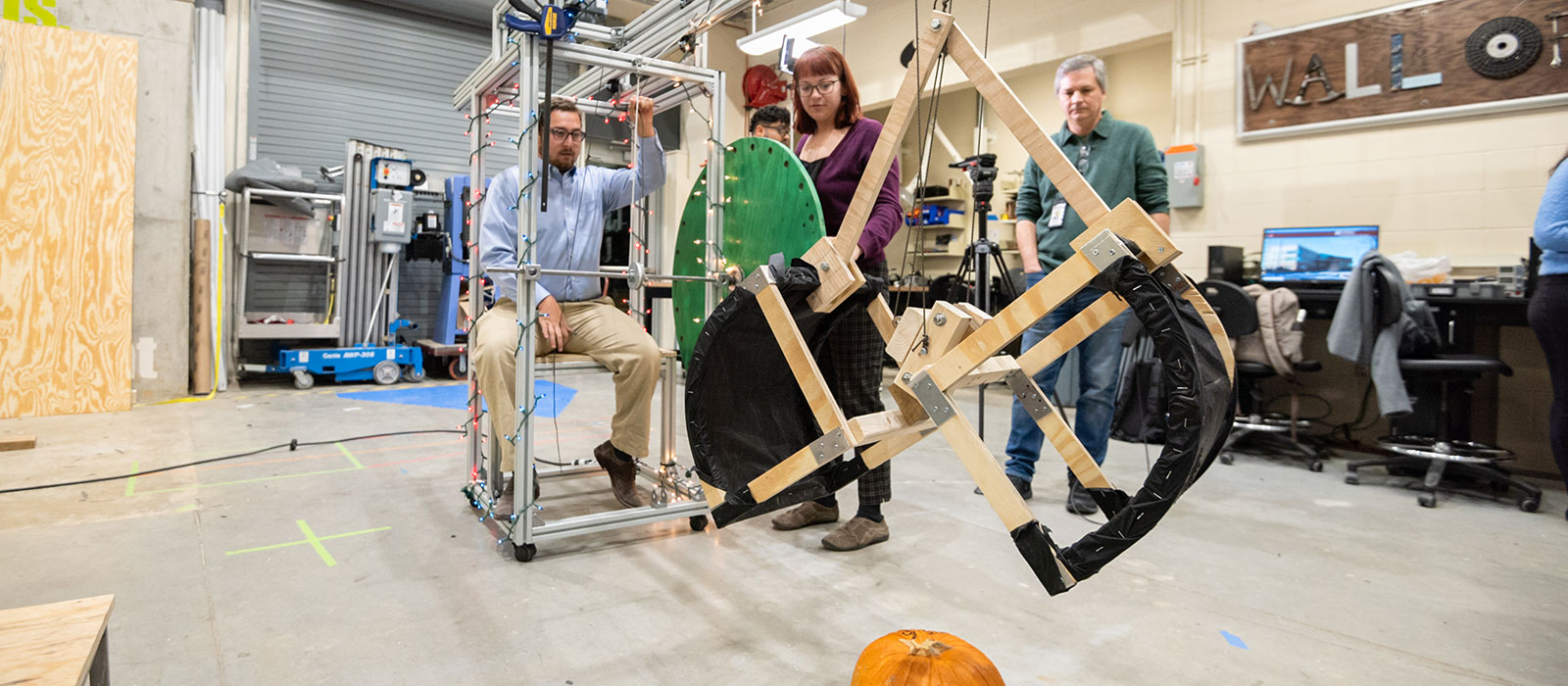 Three students working on an engineering project
