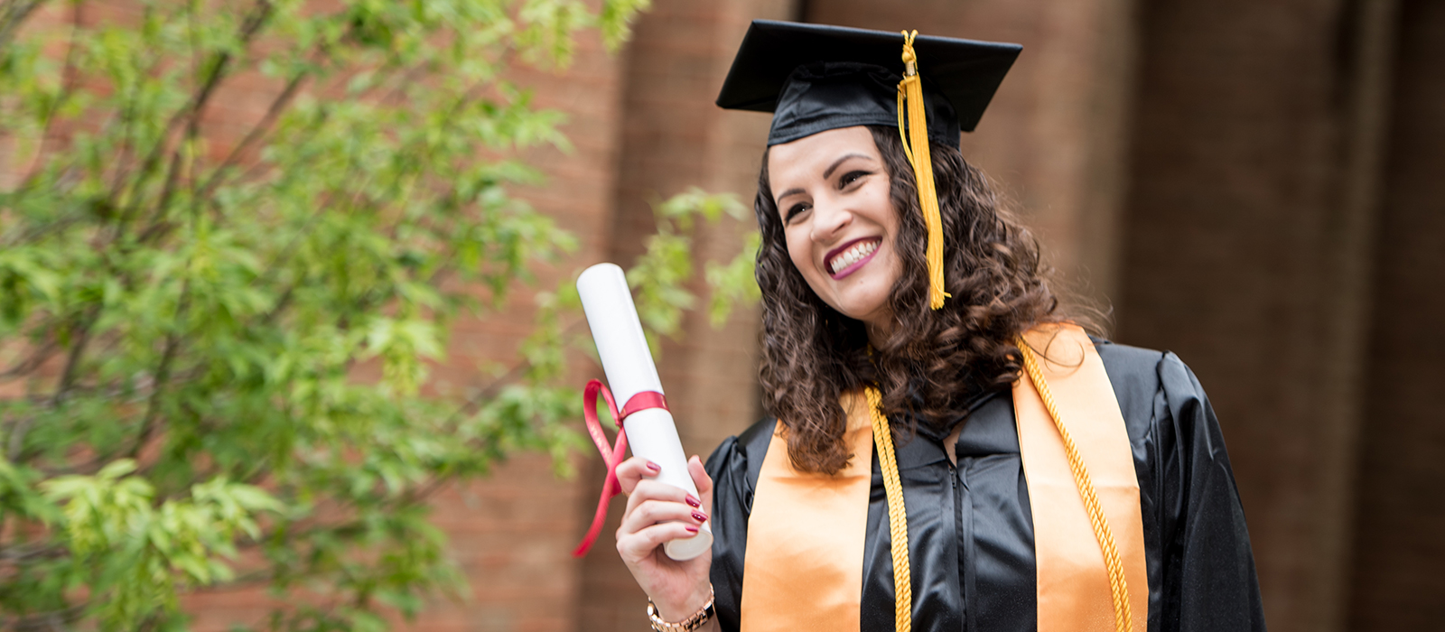 A student graduating from HCC, fulfilling the mission of Completion Services.