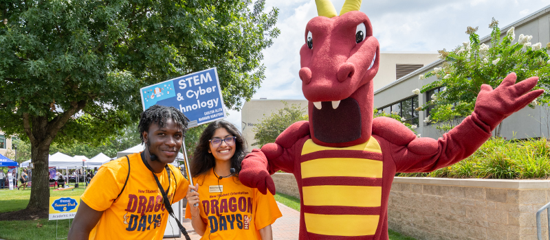 Two students wearing orange 
